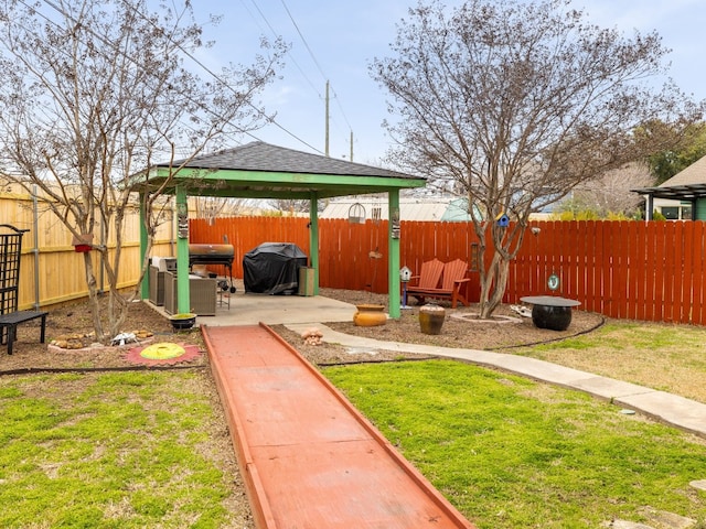 view of yard with a gazebo, a patio area, and a fenced backyard