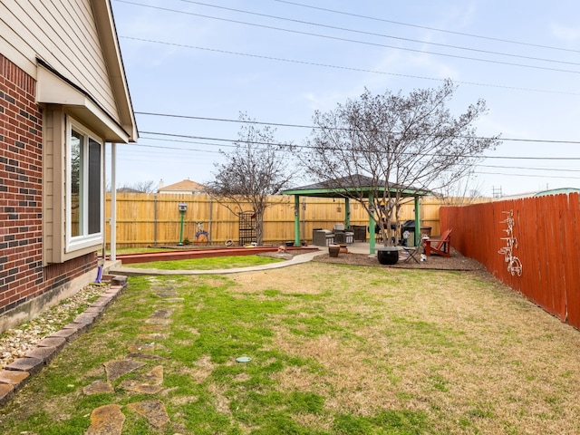 view of yard featuring a fenced backyard, a patio, and a gazebo