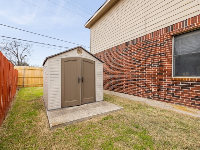 view of shed with a fenced backyard