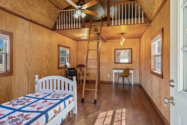 bedroom featuring wood ceiling, dark wood-style flooring, wooden walls, and baseboards