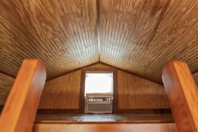 additional living space featuring lofted ceiling, wooden ceiling, cooling unit, and wooden walls