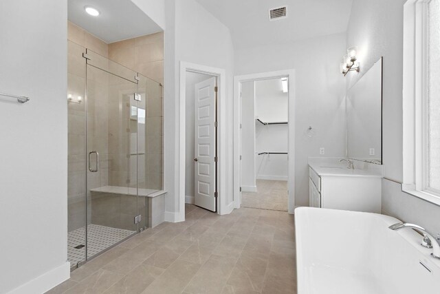 1109 Blanket Flower Dr, Georgetown, TX 78628 - full bathroom with a freestanding bath, a stall shower, a spacious closet, and vanity