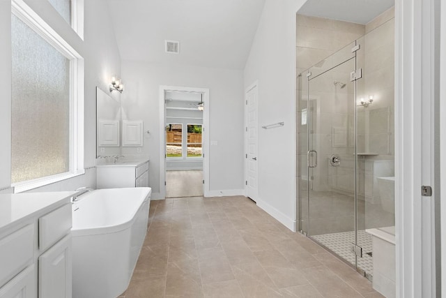 1109 Blanket Flower Dr, Georgetown, TX 78628 - bathroom with a shower stall, a freestanding bath, vanity, and tile patterned flooring