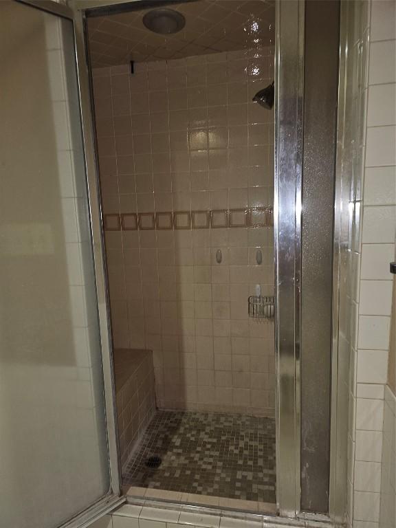 full bathroom with a shower stall