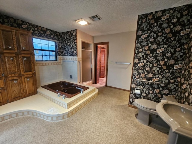 bathroom featuring baseboards, visible vents, toilet, a textured ceiling, and a shower stall