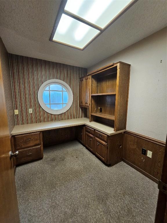 3105 Indian Mound Rd, Georgetown, TX 78628 - unfurnished office featuring carpet flooring, built in study area, wainscoting, wallpapered walls, and wood walls