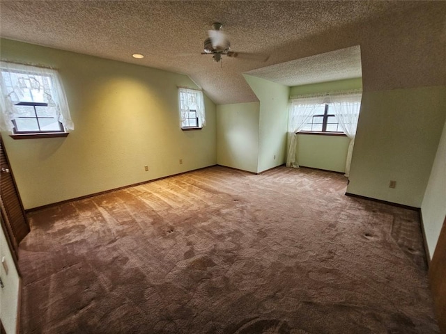3105 Indian Mound Rd, Georgetown, TX 78628 - additional living space with carpet, baseboards, lofted ceiling, a textured ceiling, and a ceiling fan