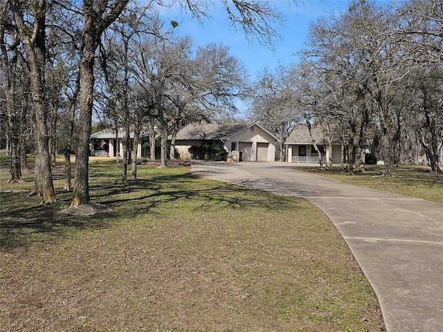 view of front of house featuring a front yard and driveway