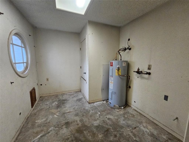 utility room featuring water heater