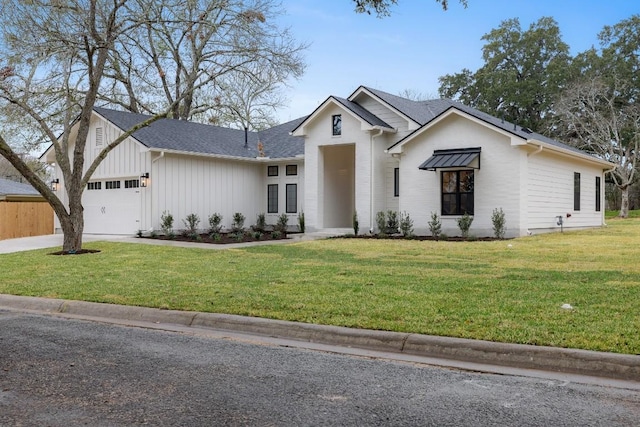 modern inspired farmhouse with a garage, a shingled roof, fence, driveway, and a front yard