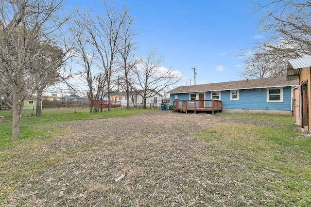 view of yard featuring a fenced backyard and a wooden deck