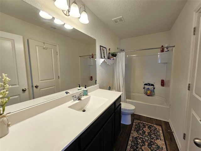 bathroom featuring visible vents, toilet, shower / tub combo, vanity, and wood finished floors