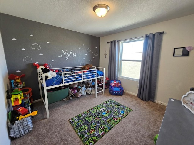 carpeted bedroom featuring a textured ceiling and baseboards