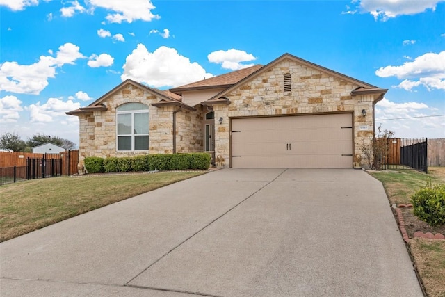 ranch-style home with a garage, fence, a front lawn, and concrete driveway