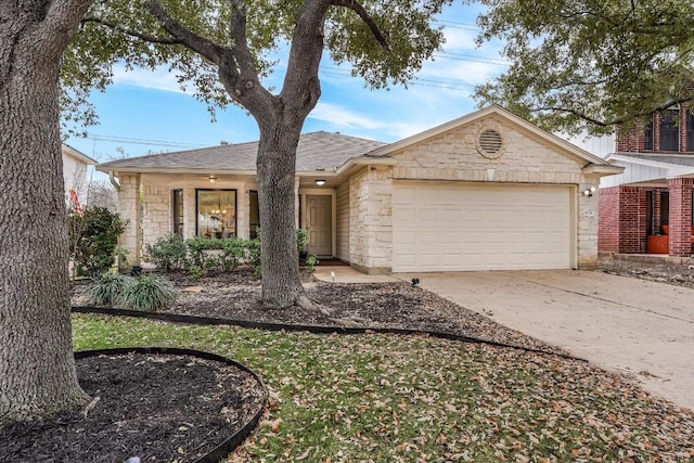 ranch-style home with stone siding, concrete driveway, roof with shingles, and an attached garage