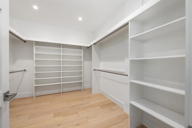 spacious closet with wood finished floors