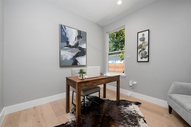 office space featuring light wood finished floors and baseboards