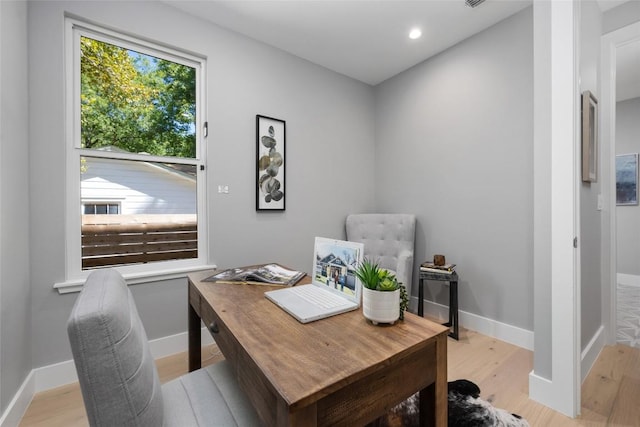 office featuring light wood-type flooring, baseboards, and recessed lighting