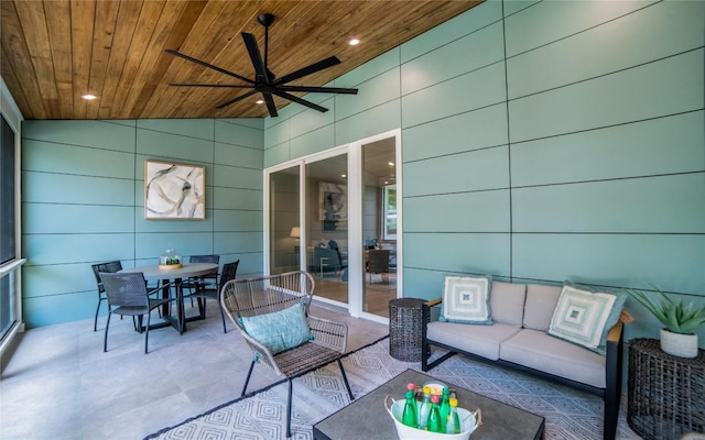 sunroom featuring wood ceiling, vaulted ceiling, and ceiling fan