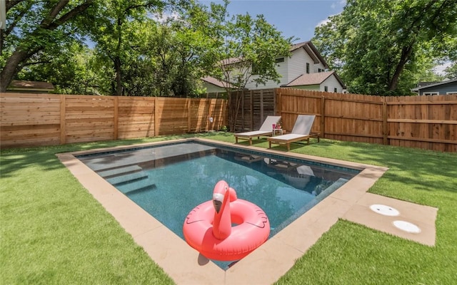 view of swimming pool with a fenced in pool, a fenced backyard, and a yard