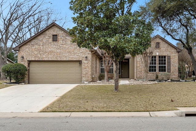 view of front of home with a garage, driveway, brick siding, and a front yard