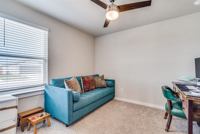 office with light carpet, baseboards, and a ceiling fan