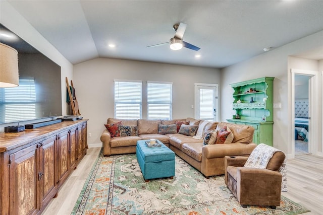 living room featuring light wood finished floors, baseboards, a ceiling fan, lofted ceiling, and recessed lighting