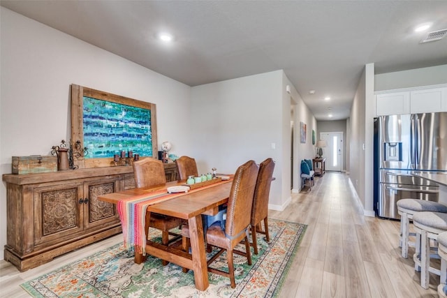 dining area featuring recessed lighting, baseboards, visible vents, and light wood finished floors