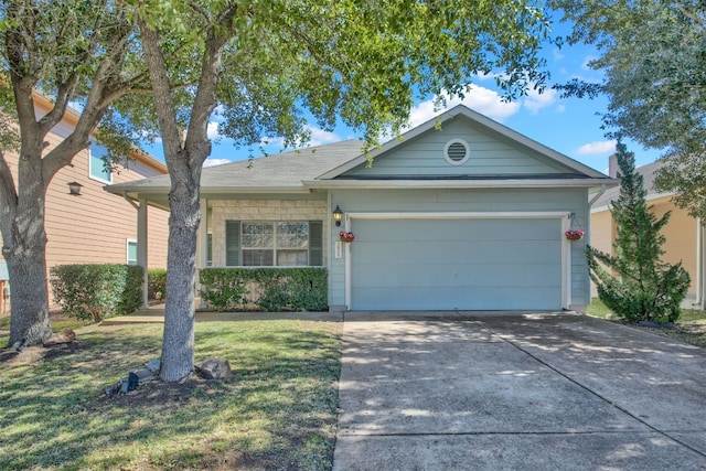 single story home with concrete driveway, an attached garage, and a front yard