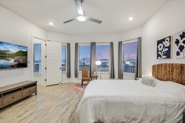 bedroom with recessed lighting, visible vents, a ceiling fan, light wood-type flooring, and baseboards