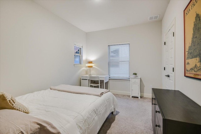 bedroom with visible vents, baseboards, and carpet flooring