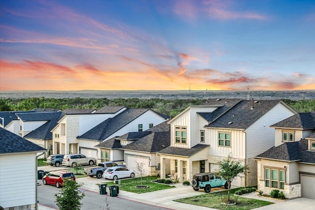 view of road with sidewalks, a residential view, and curbs