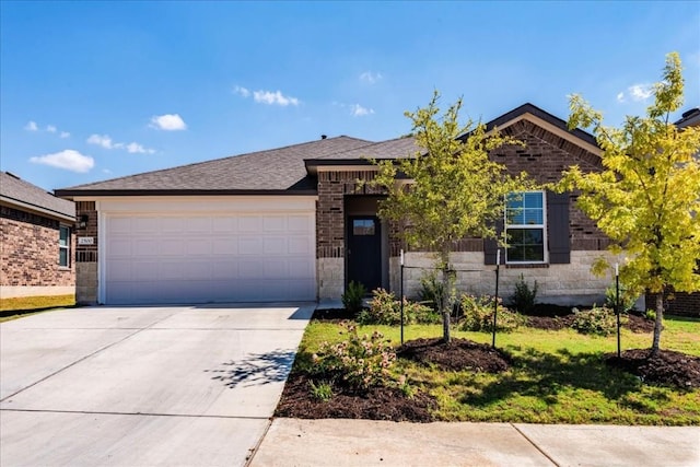 ranch-style home featuring a garage, brick siding, a shingled roof, concrete driveway, and a front lawn