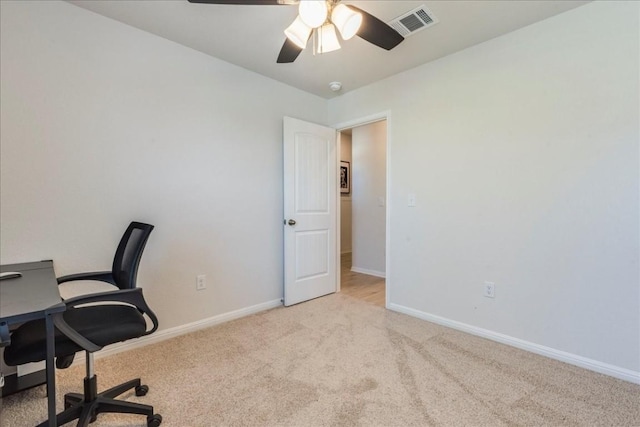 office area with carpet, baseboards, and ceiling fan