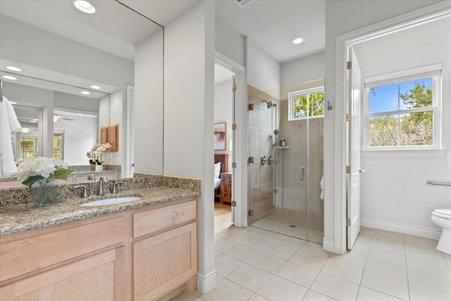 full bathroom with toilet, ensuite bathroom, vanity, a shower stall, and tile patterned flooring