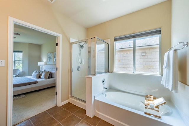 bathroom with a shower stall, ensuite bath, a bath, and tile patterned floors