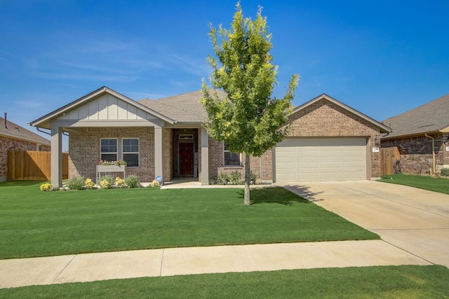 view of front of home with a garage, a front yard, brick siding, and board and batten siding