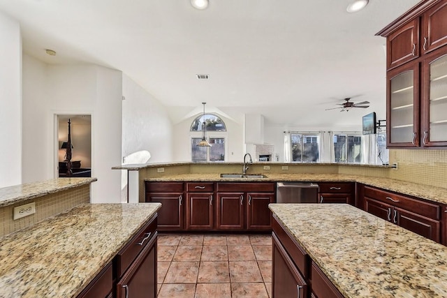 6303 Needham Ln, Austin, TX 78739 - kitchen featuring a sink, stainless steel dishwasher, tasteful backsplash, ceiling fan, and glass insert cabinets