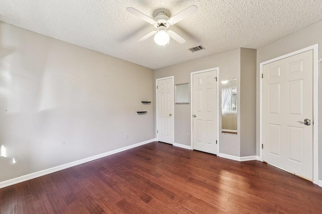 6303 Needham Ln, Austin, TX 78739 - unfurnished bedroom featuring baseboards, wood finished floors, a textured ceiling, and ceiling fan