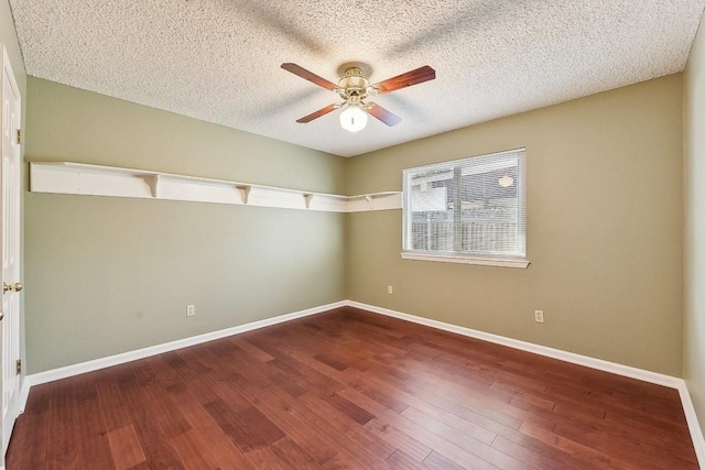 6303 Needham Ln, Austin, TX 78739 - unfurnished room with ceiling fan, baseboards, a textured ceiling, and wood finished floors