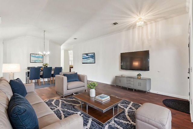 6303 Needham Ln, Austin, TX 78739 - living room with a chandelier, wood finished floors, vaulted ceiling, and ornamental molding