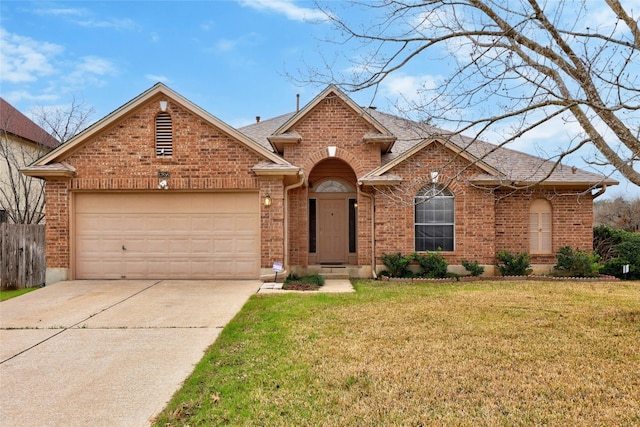 traditional-style home featuring brick siding, roof with shingles, concrete driveway, a front yard, and a garage