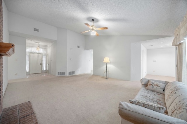 living room featuring a ceiling fan, light colored carpet, visible vents, and lofted ceiling