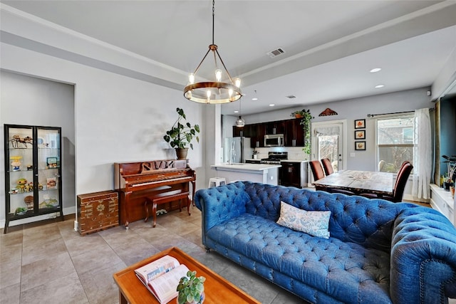 living room featuring light tile patterned floors, baseboards, visible vents, a raised ceiling, and recessed lighting