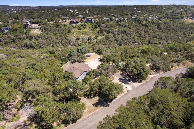 drone / aerial view featuring a forest view