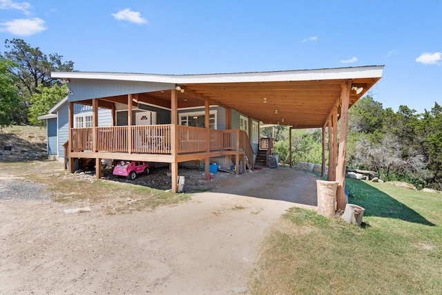 15001 Dexler Dr, Austin, TX 78734 - view of front of house featuring driveway and a carport