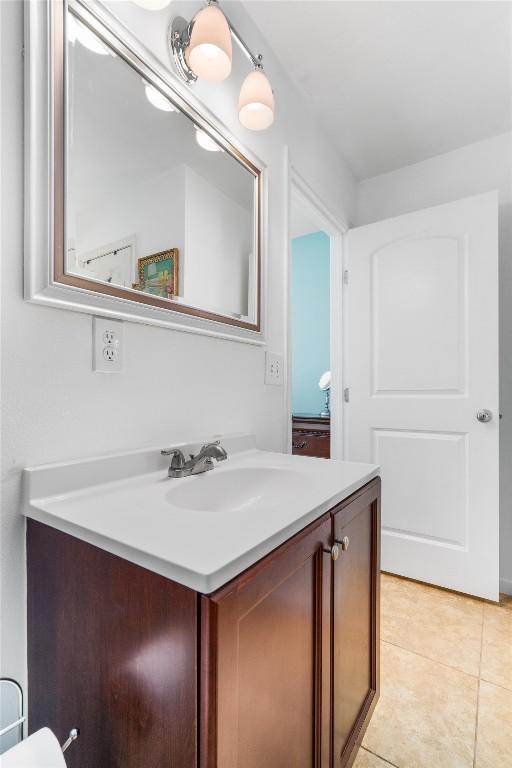15001 Dexler Dr, Austin, TX 78734 - bathroom featuring vanity and tile patterned floors