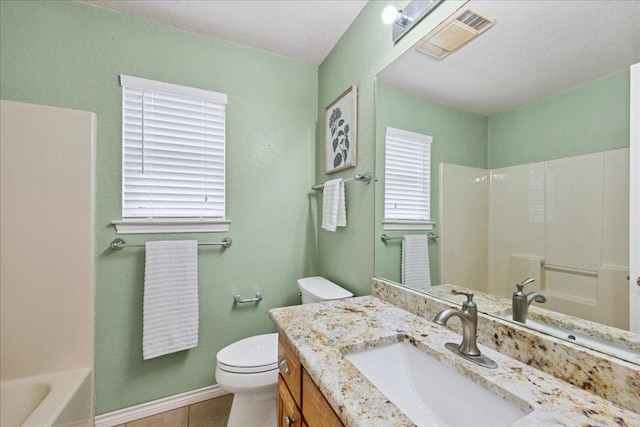 bathroom with toilet, vanity, visible vents, baseboards, and tile patterned floors