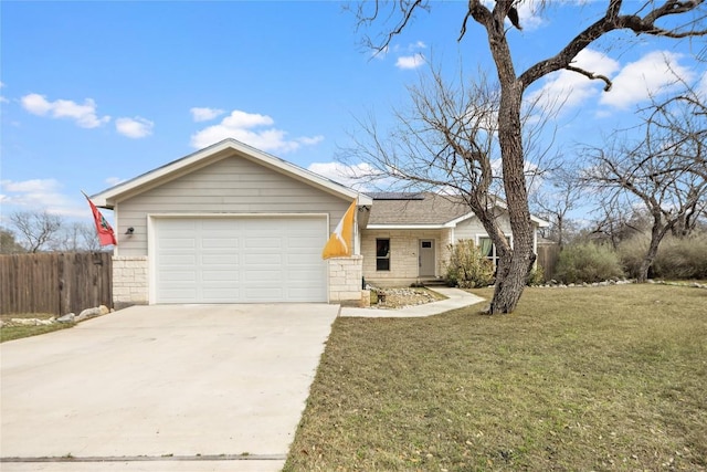 ranch-style house featuring driveway, an attached garage, fence, and a front yard