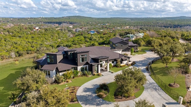 drone / aerial view with a view of trees